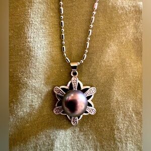 Genuine Tahitian 11-12mm round pearls on silver plated setting